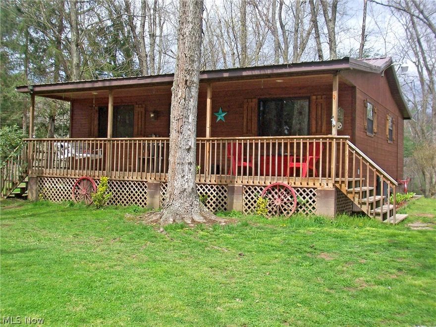 Your very own private riverfront retreat!  This log cabin is located on an acre on the Little Kanawha River.  The setting is so peaceful and relaxing.  Home has hardwoods in main living area and is low maintenance.  If you are looking to "Get away from it all", then look no further...this is it!