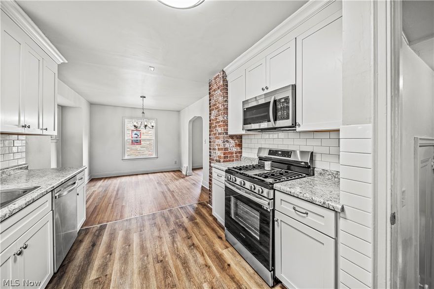 Welcome to your new home! This beautifully remodeled home combines modern updates with classic charm. Featuring an open concept layout, the new kitchen boasts soft close cabinets, stainless appliances, brick chimney and subway tiled backsplash. It opens to the dining and living room with newly finished original hardwood floors and classic hardware. Upstairs you will find three generous bedrooms, all with modern ceiling fans and lights and new carpet. The completely renovated full bath with stylish tile and fixtures offers access to the bonus room on the third floor that offers potential as a 4th bedroom or a versatile space for an office, playroom, or guest quarters. New Energy-efficient windows brighten every room and provide excellent insulation. Central air keeps you cool in the summer. Downstairs off the side entry is the laundry area, a separate shower room, a toilet and storage room. Freshly painted, it could be finished for additional living area or workshop or playroom. You will not find a nicer renovated home at this price. Schedule your viewing today and experience the perfect blend of comfort and modern living.