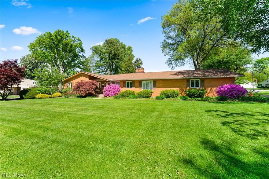 Awesome Mid Century Modern sprawling Ranch Home located in the desirable North Salem Neighborhood on a Corner Lot. Beautiful Architecture and Curb Appeal. Home Features Large Foyer with slate flooring and mid century architectural features. Huge Living Room with Large Windows allowing abundance of light and opening to a Brand New Deck. Living Room also features a gas fireplace and a wall of built in shelving for style and storage. Kitchen is bright and open to dining room featuring hardwood flooring and Jenn air gas range and oven. The main level has 3 bedrooms and 2 full baths one features a brand new walk in tub.
The lower level has a huge Rec Room with a built in wet bar, a fireplace, a half bath, laundry and workbench. There are also plenty of storage areas in both upper and lower area. The backyard in Completely Fenced in for plenty of privacy and entertaining on new deck. The home has a 3 Car Attached Garage. New Roof and Gutters and guards installed in 2020. Lovely home and bea