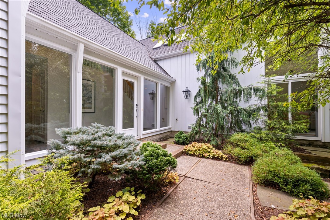 Spectacular free standing condo in Arrowood of Walden. Beautifully updated, handsomely appointed and ready for you to love Featuring soaring ceilings and open concept living. The two story great room has floor to ceiling walls of windows and automatic blinds with the push of a button, a sharp fireplace and hardwood floors all just steps from the open dining-living concept and kitchen with second fireplace and windows over looking the park like grounds. Natural wood cabinetry with granite tops and stainless appliances offer ideal entertaining value. The spacious first floor owners retreat which opens to the private patio also has a private walk-in closet and accessible bath. Roll in shower, base free cabinetry to allow for easy use. Also on the first floor and four season room or private office, guest powder room and laundry. Upstairs, the lofted space offers the third fireplace overlooking the first floor. A second suite with private bath and past the built-ins a third suite with bonus room. Must see to truly appreciate all there is to enjoy!
