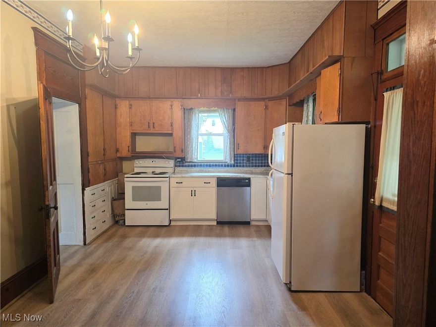 Great opportunity for your large country style home with the conveniences of quaint village living.  Five bedrooms up and the two full baths are on the main floor.  The original kitchen is mostly intact, and has been used as combo summer kitchen and laundry room. The second kitchen was installed in early 1990's leaving many original features intact.  The two full baths are on main floor.  Rooms are large with original oak woodwork throughout as well as hardwood flooring.  Kitchen has laminate as does summer kitchen.  Formal dining room off of kitchen and large family room is situated facing Cherry Street (North).  Pocket doors from dining room to living room and many original built-in throughout the main floor.  Newer furnace and A/C, newer roof.  Detached two car garage with workspace.  More pictures to follow!