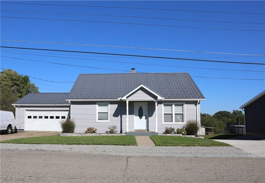 BACK ON THE MARKET AT NO FAULT OF THE OWNER...NOW IS YOUR CHANCE!!!
Are you looking for a home near shopping, schools, highways, and the state lines of Ohio, West Virginia, and Pennsylvania?  This property is for you!! This is a renovated home from top to bottom. The kitchen has custom Amish cabinets, solid and beautiful wood doors, a new roof, siding, deck, windows, a hot water tank, kitchen appliances, and flooring, all installed in 2019. A new concrete driveway was also installed in 2023. In addition to a two-car attached garage, there is a 32x60 detached four-bay garage with a new roof and siding, installed in 2019. The garage has heat, air, and water. With a beautiful backyard, there's plenty of room to entertain. Add a swing set or pool for the kids, or create your backyard oasis.