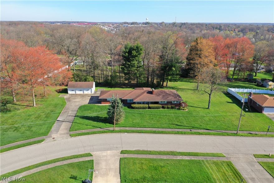 AWESOME 3 Bedroom BRICK Ranch with whole house generator, 2 Car Attached Garage (handicap accessible), 3 Car Detached Garage on 1.6 Acres of Land.  Home Features Include:  PHENOMONAL Front Living Room with Fireplace, Large CUSTOM Kitchen with Granite Countertops, Stainless Steel Appliances, Pantry, & Breakfast Area, 3 Large Bedrooms, UPDATED Handicap Bathroom with Walk in Shower, Elevator to Rec. Room Area, First Floor Office, Half Bath & First Floor Laundry Room.  The Lower Level offers a HUGE Rec. Room Area with Fireplace & Shop/Man Cave Area.  There is a Covered Back Patio which leads to a Private, Scenic Backyard.  There are hardwood floors under all carpet areas.