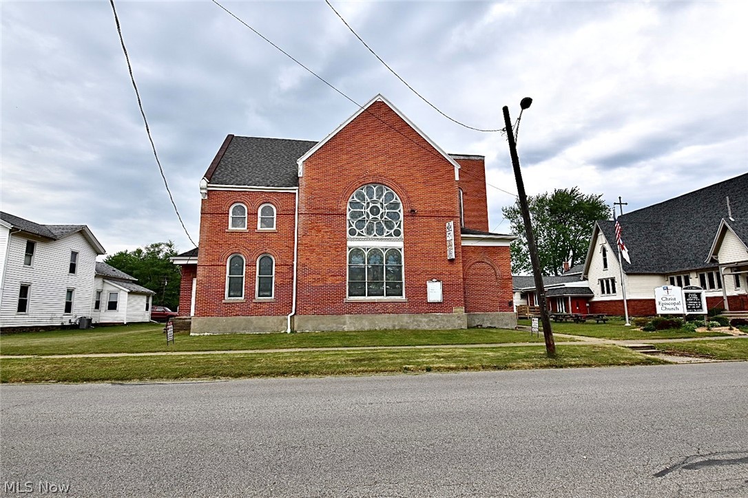 This BEAUTIFUL, solid Brick building was built in 1920 and has been designated as a century building. Gorgeous stained glass windows bring light and art to the rooms with soaring high ceilings. The possibilities for this building are endless - it can serve as a church again, a winery/brewery or restaurant, spa, bed and breakfast to serve all the visitors that come to the area visiting wineries, or so many other options! Bring your imagination and creativity!