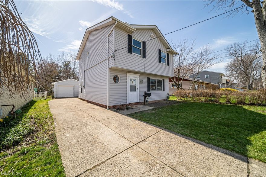 Bright and beautiful, updated colonial, minutes from Lake Erie, parks, and shopping.  Upstairs you will find 3 bedrooms with large master suite, attached private bath, and oversized walk in closet.  Brand new carpeting, updated flooring and freshly painted throughout, in lovely modern tones! Spacious living room flows into dining area with glass sliders, overlooking deck and fenced yard.  Separate laundry/ mud room off of kitchen, with attached main level powder room. Spacious paved driveway with plenty of parking and detached 1 car garage with extra shelving and workbench space. This home is well maintained and move in ready! Home also comes with a 1 year America's Preferred Home warranty.