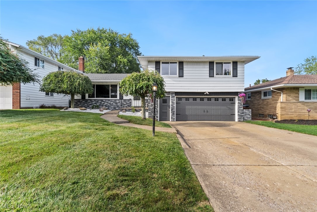 Welcome to your dream home at 2100 WinterPark in Parma, Ohio! This exquisite residence has been thoughtfully updated and meticulously cared for, offering a perfect blend of modern luxury and timeless charm. As you step inside, you'll be greeted by an open and inviting floor plan. The heart of the home, a beautifully remodeled kitchen from 2018, features stunning granite countertops, a new refrigerator (2021), and a brand-new dishwasher (2025). This culinary haven seamlessly flows into the dining room and living room, creating an ideal space for entertaining and everyday living. The exterior is just as impressive. The home's curb appeal was elevated in 2024 with a custom-stained brick finish. Step outside to your private oasis, where a brand-new paver patio (2025) awaits. This beautiful space is perfect for outdoor dining, summer gatherings, and peaceful relaxation. New landscaping rock (2025) adds the perfect finishing touch. You'll also appreciate the significant updates that provide peace of mind and long-term value, including a complete roof tear-off and new roof with ice and water shield (2015) and a new hot water tank (2025). The home also features a rare and highly sought-after amenity: a heated and cooled garage, providing comfort and versatility year-round. Location is key, and this home offers unparalleled convenience. Situated within walking distance of both Green Valley Elementary and Normandy High School, it's an ideal location for families. Plus, you're just 2 miles from I-77, making your commute and travel a breeze. Don't miss the opportunity to own this exceptional Parma home, where every detail has been considered for your comfort and enjoyment. Schedule your showing today and experience all that 2100 WinterPark has to offer!