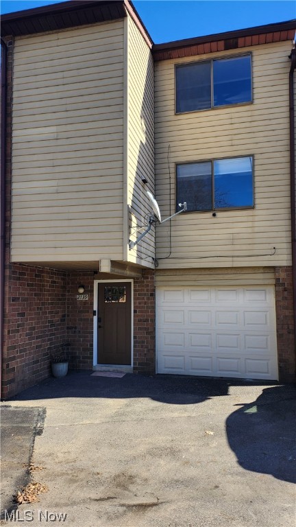 Welcome to this newly updated condo only minutes away from Portage Lakes! Upon entrance into the beautiful foyer, you'll find the attached single stall garage with storage space along back wall, and separate storage area with laundry room mechanical systems. Right at the top of stairway landing is the recently refinished full kitchen that includes all appliances. Adjacent to the kitchen is a large great room area, spacious room for entertainment with guests, and a walk out deck overlooking a pond to enjoy your cup of daily coffee on. Up the metal spiral staircase, you can find the lofted and spacious master bedroom with high pitched ceiling, wonderful natural lighting. Do not miss your opportunity to own this well-kept condo within close proximity to all of your essential needs for outdoor activity and enjoyment. Nice updates done throughout.