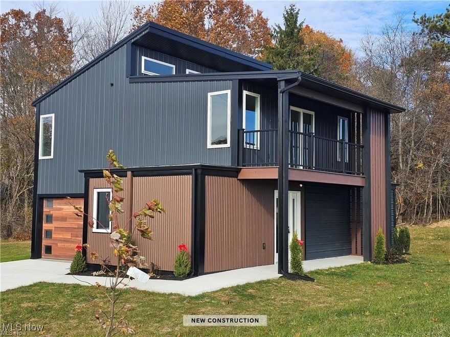 Welcome to this newly constructed modern home, designed with exceptional craftsmanship, high efficiency, and elevated style throughout. The exterior makes a bold impression with its striking black finish and contemporary wood garage door, setting the tone for the thoughtful design inside. As you step onto the covered front porch and enter the home, you are welcomed by a well-planned main floor that includes a comfortable living room, a stylish kitchen, a bedroom, and a full bathroom. This level also features a convenient laundry room, a space-saving dishwasher, and direct access to the one-car garage. The home is built with energy efficiency in mind, featuring spray foam insulation and SIP (Structural Insulated Panel) construction for superior temperature control and reduced energy costs. Split units provide efficient heating and air conditioning throughout, ensuring year-round comfort. Moving upstairs, you’ll notice the custom-built storage drawers integrated into the staircase—an innovative feature that adds both function and character. The upper level opens into a large multi-purpose space that can serve as an additional bedroom, home office, or flexible living area. This space is already plumbed for an optional extra bathroom, offering even more potential for customization. Additional storage is also available on this floor. Overall, this home blends modern design, smart energy-efficient upgrades, and versatile living spaces, creating a property that is both stylish and incredibly functional.