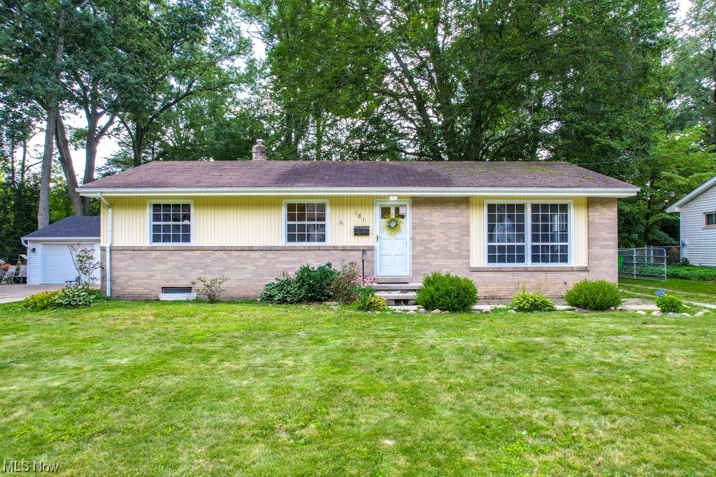 Enjoy the ease of one-level living! This adorable mid-Century ranch in Munroe Falls has 3 Bed/1.5 Baths, nearly 1200 square feet of living space, beautiful hardwood floors, and neutral paint throughout. The kitchen containing all appliances, the half bath, and the dining room all feature ceramic tile floors, while the refinished hardwood floors in the living room and Primary bedroom absolutely gleam. The Primary bedroom also features an attached half bath that is shared off the dining room. Head downstairs to the spacious full basement with two large cedar closets perfect for storage and utility area that includes a washer and dryer. A spacious fenced backyard provides the perfect spot to unwind or entertain or let your 4-legged friends romp, and the oversized 2.5 detached car garage is a mechanics or hobbyists dream. Conveniently located just minutes from Munroe Falls Metro Park and Adell Durbin Park and close to the shops and restaurants of Stow/Kent. Don’t miss out! Make an appoint