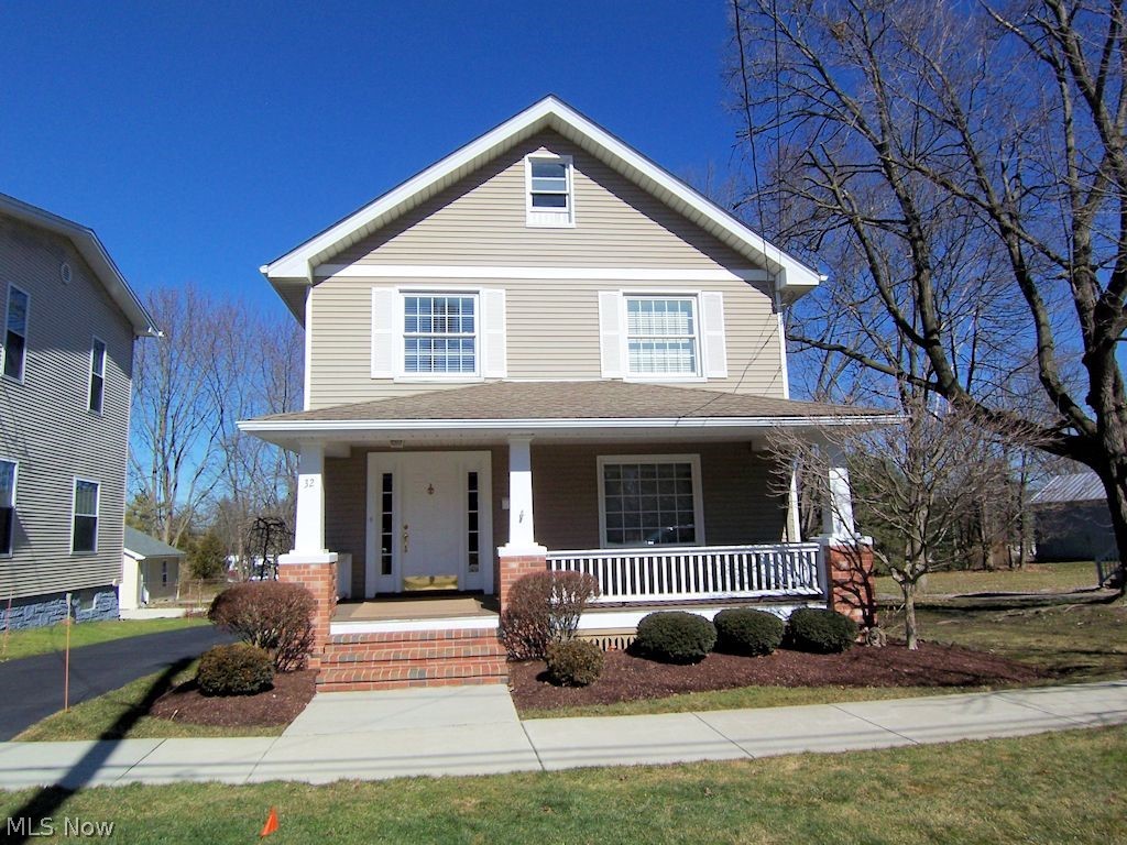 Absolutely nothing to do to this beautiful home. Located in the center of Canfield and just steps from "The Green" this home features a spacious living room complete with a stunning fireplace, dining room with bay window and kitchen, all of which preserve the vintage era of the home. There is a half bath off the kitchen and an enclosed back porch room (7x6), Upstairs includes 3 sunny bedrooms and a large spa inspired full bath with tiled shower and seperate tub plus double vanity area. The oversized double garage is detached and located behind the home There is ample parking/turn around area in front of the garage. The back of the home is landscaped and includes a private deck. The front of the home includes a huge covered porch and brick steps. Laundry is located in the basement and there is a workshop also. This area has sidewalks and stree tlights and isn't far from the Canfield Fairgounds and the Mill Creek biking trail. Easy access to highways and shopping and yet you r