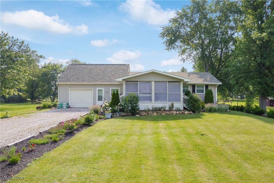 Welcome to this quaint, renovated cottage, located in the serene countryside of Rittman! Completely updated from top to bottom (including the roof and ceilings) in 2020, this bright and airy home blends charm with modern amenities. 
The inviting screened front porch welcomes you inside to an open family room filled with natural light and sweeping ceilings. 
Prepare culinary delights in the updated gourmet kitchen, featuring abundant cabinetry, sleek granite countertops, stainless steel appliances, a tile backsplash, and is plumbed for a dishwasher. Adjacent to the kitchen, the spacious dining area offers sliders that lead out to a peaceful brick patio, perfect for outdoor dining and entertaining.
The main home includes two comfortable bedrooms and a luxurious full bathroom. 
Additionally, the property features a private in-law suite complete with its own living room, full bathroom, bedroom, and kitchenette, offering flexible living arrangements for extended family or guests! 
The laundry room is conveniently located on the first floor.
An unfinished basement provides ample storage or future expansion opportunities.
Nestled on nearly one acre (.95 acres), the property boasts well-maintained landscaping, brick patio, a garden bed, and two outbuildings for extra storage or hobbies. 
An additional highlight includes a spacious, attached 1-car garage.
This home’s extensive renovation in 2020 showcases a new furnace, roof, well pump, pressure tank, and windows! For additional peace of mind, there was a septic inspection completed in 2024. 
This move-in ready home offers a rare combination of privacy, modern updates, and country charm. Don’t miss your opportunity to make this special property your new home!