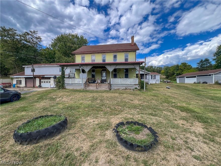 Expansive farmhouse offering 7+ bedrooms, 4 full bathrooms, and over 4,100 sq ft of living space, all situated on 5.41 acres with multiple outbuildings ideal for a variety of uses. The property features a detached 3-car garage complete with a workshop and second-floor carpenter’s shop, a 50’x32’ pole building with two garage doors, and a two-story barn—perfect for hobbyists, business use, or additional storage. The main farmhouse includes two fully remodeled full bathrooms, updated windows by Window World, a newer gas furnace and hot water tank (2024), and an updated electrical service and breaker box (2025). The main level offers two bedrooms, a full bath, a kitchen, a dining room with built-ins, and a spacious 704 sq ft living room with a fireplace—ideal for gatherings. The second floor provides additional flexibility with a small kitchen, living room, full bathroom, and two bedrooms, making it well-suited for extended living arrangements. A rear addition serves as a fully equipped in-law suite featuring three bedrooms, two full bathrooms, a living room, kitchen, dining area, laundry room, and both front and rear decks—offering privacy and comfort for multi-generational living. A rare opportunity to own a versatile property with abundant space, functional outbuildings, and modern updates—all in a peaceful setting.
