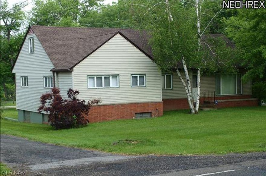 Wonderful opportunity to invest. Spacious 5 bedroom Cape Cod home with 2 baths. Hardwood floors. 3 bedrooms down and 2 upstairs. A large living room with fireplace. Eat in kitchen. Very nice  1 bedroom apt(currently rented)in basement that has its own separate entrance. If that isn't enough, a remodeled 780 sq. ft. 2 BR 1 Ba house sits behind this house (currently rented). You can also find a Detached 22x24 2 car garage to use for yourself or lease that out too. Possibilities are endless. All this in the Howland School District.