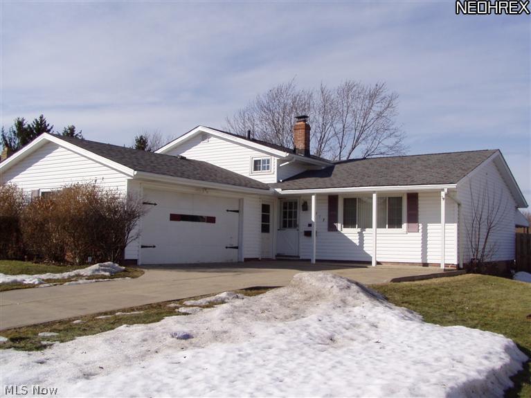 Sharp 3 bedroom, 2 full bath split level with 2 car attached garage plus 22x11 covered deck and fenced yard. Interior boasts updated laminate flooring throughout (no carpet); newer windows; skylight in kitchen; and neutral colors. Open design with formal dining room, living room and eat-in kitchen on first level. Family room and laundry room on lower level. Nature Stone in garage. Great neighborhood! Buy now while rates are still at historic lows!