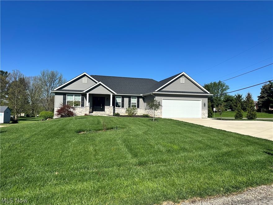 This lovely Schlabaugh Built Custom Home has wonderful curb appeal and awesome amenities throughout. The .55 acre lot and covered deck, that could be easily screened in, lend themselves nicely to outdoor entertaining. The cement driveway has a generous turnaround for additional parking. A well thought out open floorplan balances a guest wing on one side with two bedrooms and a full bath and the owner's suite on the opposite which boasts a doorless, walk-in tiled shower with a bench seat in the bathroom. Each bedroom has a walk-in closet with switched lights. The heart of the home offers a gas fireplace in the living area and quartz countertops, soft close cupboards with pullouts and a pantry closet in the kitchen. The two car garage is insulated and finished. The basement is insulated above ground level with a large window for natural light. The neutral palette, combination of nicely padded neutral carpets and laminate floors, custom doors and woodwork make this very gently lived in home move in ready. Call your favorite agent and schedule an appointment to see your new home