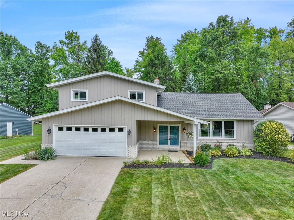Welcome to this beautifully updated North Solon split-level with a finished basement, offering the perfect blend of comfort, style, and functionality. From the moment you arrive, the charming front porch invites you to relax and sets the stage for what you’ll find inside. Step into the spacious foyer, accented by a modern glass railing that adds a contemporary feel. The foyer flows into a bright living room, dining room, and kitchen, all tied together with newer luxury vinyl flooring that enhances the open and airy design. The updated eat-in kitchen is a highlight with granite counters, tiled backsplash, and newer stainless steel appliances, offering everyday convenience and an attractive gathering space. The glass railing continues between the kitchen and family room, further opening the space and providing a sleek, stylish touch. The kitchen flows seamlessly into the large family room, where a beamed ceiling and brick-accented fireplace create warmth and character. Oversized sliding doors lead to a covered patio and spacious backyard, perfect for outdoor living and entertaining. Upstairs you’ll find three comfortable bedrooms with laminate flooring. Both bathrooms on this level have been tastefully updated: the hall bath features vinyl flooring and a tub/shower combo with tile shower walls, while the primary bath offers tile flooring and a walk-in shower with tile shower walls. The finished basement expands your living space with a large recreation room featuring luxury vinyl flooring, ideal for a playroom, home theater, or workout area, plus a generous storage room. Additional updates include replaced front windows for peace of mind. Located within walking distance to Lewis Elementary School and the playground, this move-in ready home is set in a sought-after area with easy access to shopping, dining, and major highways. With modern updates, stylish finishes like the glass railing, and spacious living areas, this home is ready to enjoy!