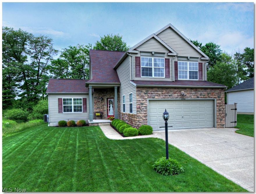 Impeccably maintained stone and vinyl sided 3 bedroom, 3.5 bath colonial located adjacent to green space features a total of 2,929 square feet, including fully finished basement.   Unique first floor plan features angled front entry which leading to spectacular 2 story great room with fireplace surrounded by windows to provide plenty of natural light; opening to home office and spacious kitchen (stainless steel appliances remain) with breakfast bar and morning room with vaulted ceiling all with beautiful Australian Cypress hardwood flooring and modern toned paint scheme; sliders off morning room lead to extra large patio with built in fire pit and private area for hot tub (electric box already installed) overlooking beautifully landscaped lush green yard watered by irrigation system!   2nd floor features owner's suite with master bath and walk-in closet, 2 additional roomy bedrooms and guest bath.   Fully finished lower level includes extra large recreation room, full bath and exercise