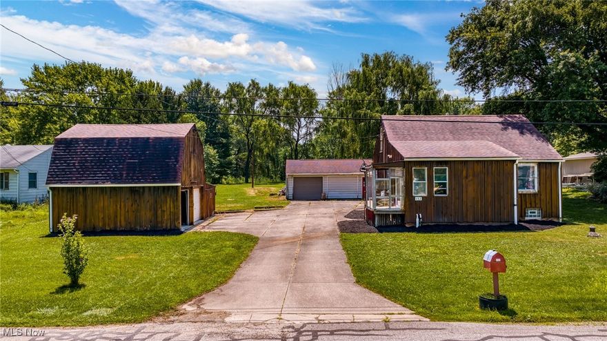 Looking for privacy, land, and space to create your own homestead or hobby retreat? Welcome to 152 Harper Road — a unique opportunity to own a charming 2-bedroom, 1-bath home situated on nearly 1.5 acres in Streetsboro.

This property features a large detached 2-car garage with a loft, a barn with plenty of storage potential, a separate workshop, and not one—but two—ponds, including a stocked pond ready for fishing. Enjoy the outdoors from your gazebo, watch the windmill spin in the breeze, or garden, entertain, and explore on your spacious lot.

Inside, you'll find a cozy living room, sunny dining area, a spacious kitchen with built-ins, and a walk-out basement that’s been waterproofed and includes a finished bonus room perfect for a second bedroom or office.

Major updates include a newer roof, newer well, newer septic system, and waterproofed basement, giving peace of mind to buyers. Conveniently located just minutes from downtown Streetsboro, shopping, dining, and Route 303/480 access — all while offering that “off-the-grid” country charm.

Don’t miss your chance to enjoy rural living with city convenience. Schedule your showing today!
