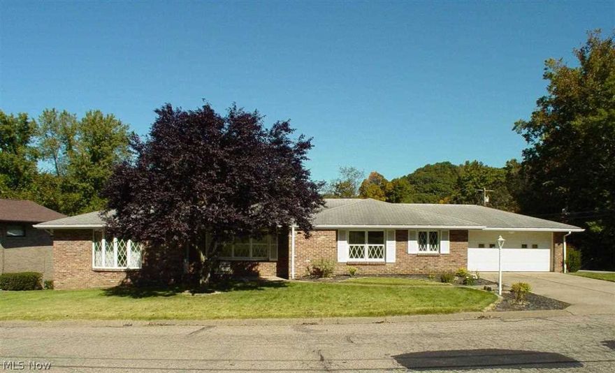 Spaciously 3 BR, 2 BA brick ranch for level living at it's best! Beautiful oak floors, sunken living room, huge finished rec room w/ gas log FP & wet bar. Unreal amount of storage. 2 car attached garage.