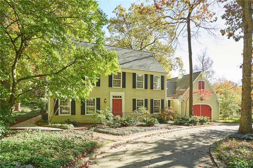 Custom-built by Phil Franz, this classic center-hall Colonial in sought-after Fairlawn Heights exudes timeless elegance, Connecticut charm, and sweeping wooded views. A spectacular Great Room—anchored by vaulted ceilings, tile floors, French doors opening to patios and garden paths, and breathtaking vistas—sets the stage for both gatherings and everyday enjoyment. Double doors lead to the inviting Family Room featuring a stone fireplace, hardwood floors, beamed ceilings, and built-ins. The cheerful Kitchen offers an eating area, greenhouse window, and access to a private brick patio, while formal Living and Dining Rooms lend a sense of tradition and grace.  A convenient back hall includes a first-floor Laundry and Powder Room. Upstairs, the Primary Suite features a window seat, en-suite Bath, Dressing Area, and a charming Office with built-ins. Three additional Bedrooms share a Hall Bath with double sinks, each with generous closets and solid wood doors. The lower level provides a Recreation Room with wet bar and abundant storage. A heated two-car Garage completes the home. Outside, mature trees, brick patios, a garden, walking paths, and a barnstone fountain frame the property in natural beauty—creating serene outdoor settings to enjoy year-round.  Many have admired this home from afar for years—now’s your chance to experience the views that make it truly unforgettable.