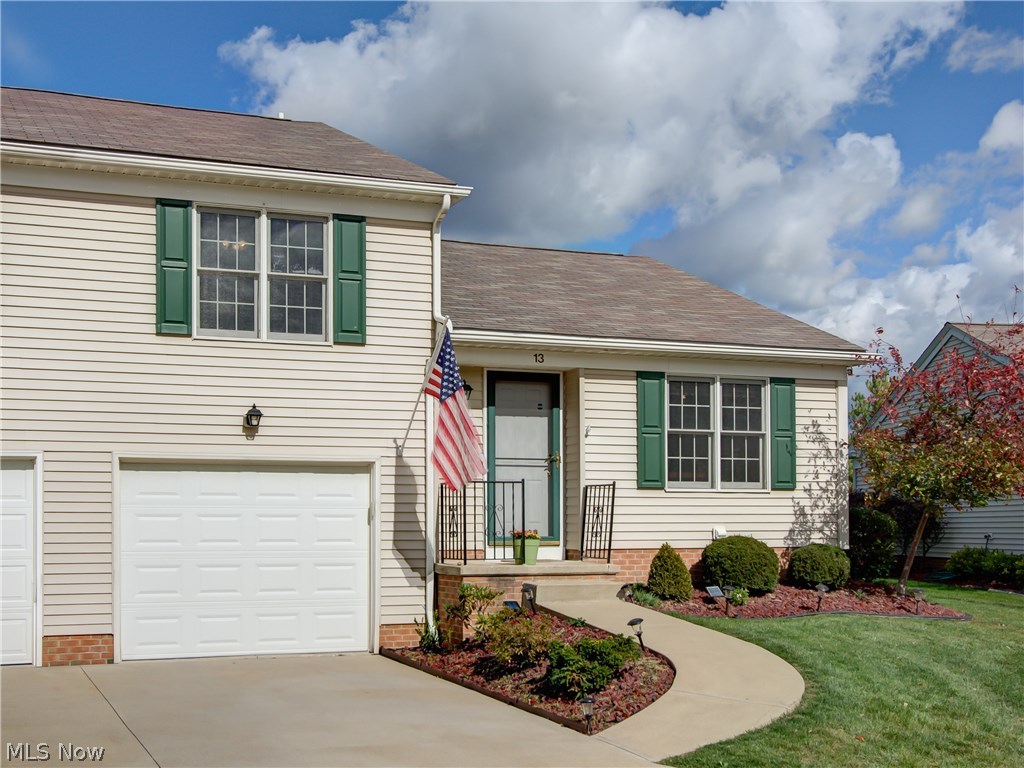 Sturbridge Commons Cluster Homes... Maintenance free living at its finest! This 2-story end unit features vaulted great room with slider to private, enclosed patio with waterfall reflecting pond. Updated kitchen with new flooring and eating area. Master bedroom with his and her closets and private half bath. Great room offers flexible space for a formal dining area and or office. Separate utility room for laundry and extra storage, tandem 2-car garage with work area and much more! Other recent improvements are freshly painted walls and new carpet. HOA fee of $125 maintenance free living includes water/sewer, trash, snow removal and landscaping.