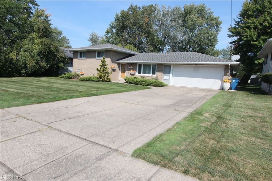 Solid brick extremely well maintained bi-level home with spacious and flowing floor plan! Enter to the front living room with custom craftmanship ornate plaster work detailed thru out. 1st floor offers formal living and dining rooms with a central kitchen and appliances that stay. Step downstairs to the cozy family room with gas fireplace and then thru to the half bath! Upstairs 3 bedrooms and a full bath and a clothes chute to boot! All room are carpeted and all have beautiful hardwood floors beneath! A sunning private patio in the backyard with lush landscaping and lots of room to roam. A 2 car attached garage with lots of extra room is all yours.