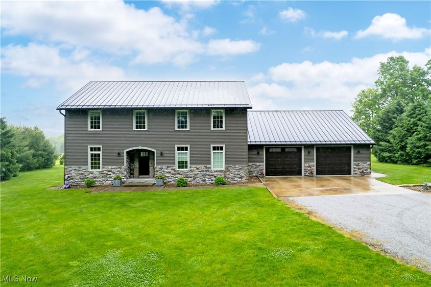 Nestled privately off the main road and surrounded by mature trees, this one-owner custom-built home offers 3,280 square feet of thoughtfully designed living space, including a 1,624-square-foot walk-up basement. With 3 bedrooms and 3.5 bathrooms, the home features an open-concept main floor adorned with ¾” maple hardwood flooring, a gourmet kitchen with soft-close maple cabinetry, granite countertops, under-cabinet lighting, and a large walk-in pantry. A striking Heartland custom staircase adds architectural charm, while the spacious family room and main-floor office offer flexible living options—both easily convertible into additional bedrooms. Comfort and convenience abound with heated floors in the basement and garage, multi-zone heating and cooling, and a built-in stereo system in the main living area and primary suite. The large mudroom includes custom built-in cubbies, and the main-floor laundry enhances everyday ease. Outdoor living is a delight with an 18x32 stamped concrete patio—half covered and equipped with ceiling fans and lighting. The patio roof features beautiful ¾” tongue-and-groove stained pine on the ceiling, with outdoor speakers wired directly to the living room stereo system, creating the perfect space for entertaining or relaxing in comfort. Additional highlights include a 16x12 shed, a 3-stall garage with backyard pull-through access, a tankless water heater, central vacuum system, and a durable metal roof. The basement is ready for future expansion with a rough-in bathroom and “no burn coating” trusses, making this home as functional as it is beautiful. The pictures don’t do this home justice—it's truly a must-see!