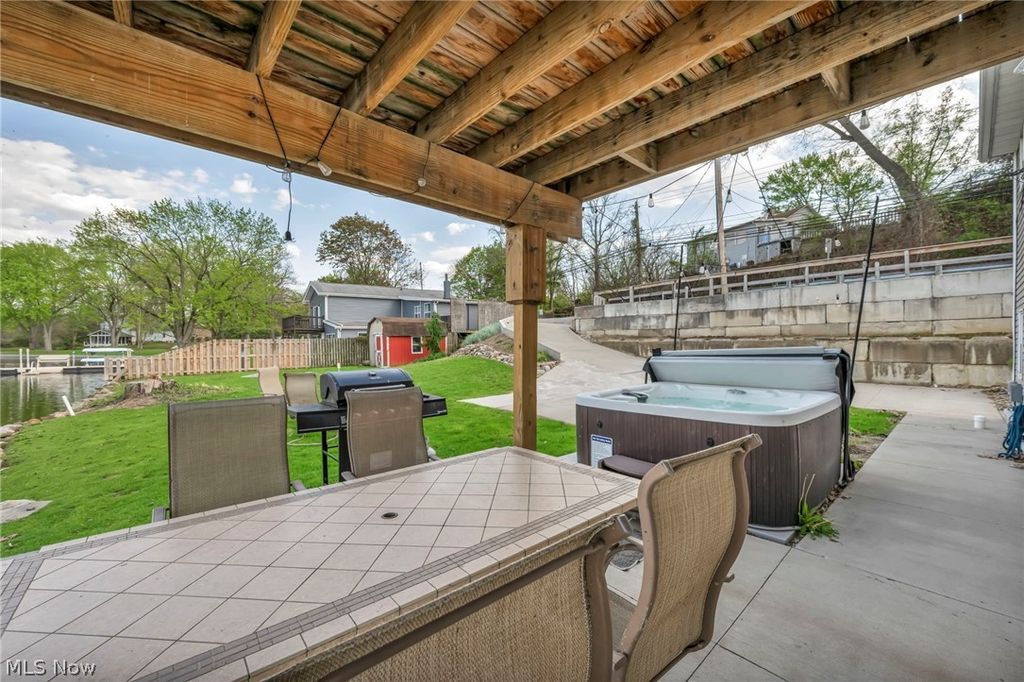 Photo of 829 Portage Lakes Drive, Akron, OH 44319 (MLS # 5204231)