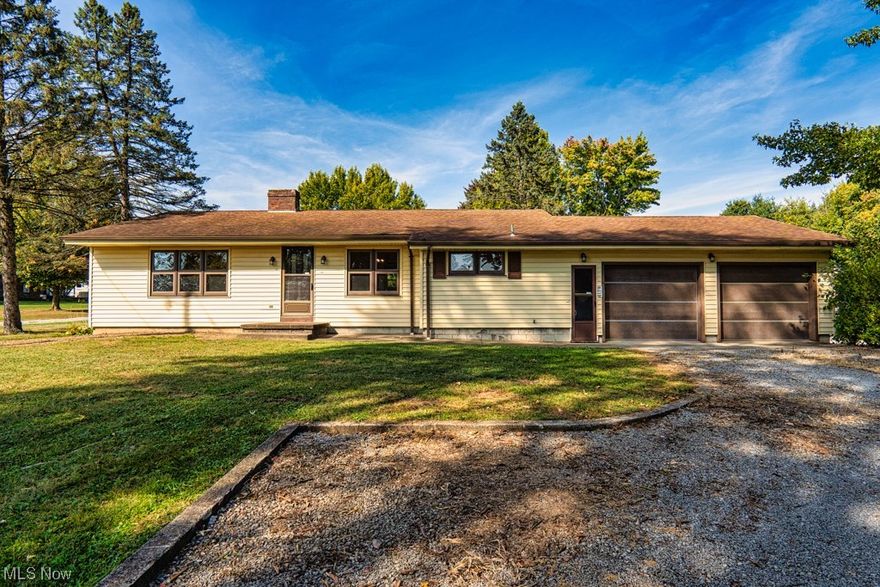 This charming ranch style home sits on 2.1 acres offering ample space and privacy, plus the home is located  close to Crestview Schools.  It  boasts 3 spacious bedrooms and 2 full baths, one of them being an updated Master bath w/walk in shower.  Home offers a large living room with an electric fireplace, plus nice size dining room for your entertaining. Kitchen has much to offer with spacious counter space and lots of cabinets, also offers  a convenient place for a coffee bar, plus you  have a first floor laundry for the buyer's convenience.  Hardwood floors are in the whole house except for the new flooring in baths, kitchen and laundry area.  Basement is large and open with a wood burning fireplace, be a perfect family room and plenty of room for a work shop or play room for the kids on the other side.  The basement was waterproofed by Ohio State Waterproofing for peace of mind, unfortunately current seller has no information on any  warranty.  There is also a laundry hookup in basement, if you would like to make the 1st floor laundry into a mud room.  Modern upgrades include a new 200 amp electric service, a one year old furnace and central air system for year-round comfort, A newer roof ensures durability, home is freshly painted and all new lighting. The home is having a new well drilled within 4 weeks. The garage is 28x28 with 2 garage doors and one door opener.  Come take a look, you won't be disappointed!