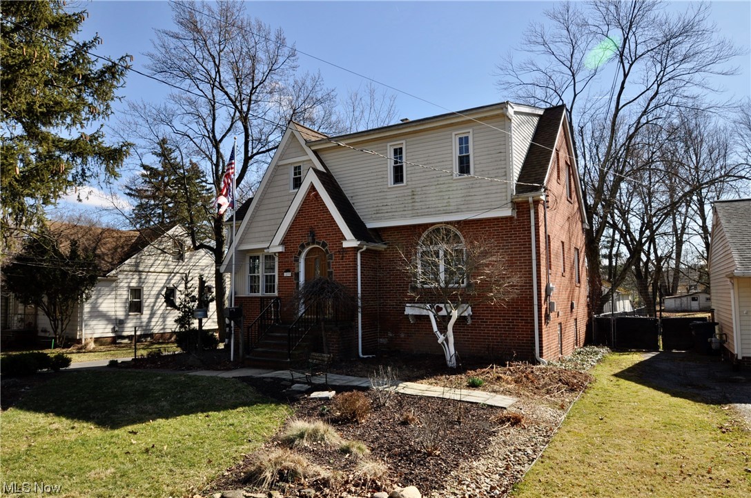 Welcome home to your meticulously maintained Tudor in Parma. Situated on almost a 1/2 acre is such a rarity in the area. Enter through the front door and vestibule you will see the custom reading room with built in shelving to the left. To the right is the family room with a stone fireplace and large arched window overlooking the front yard. Continue back throughout he formal living room with original hardwood floors. The eat in kitchen was updated with custom cabinets and granite countertops. Upstairs is the large primary bedroom, 2 other bedrooms and the full bath. The walk out basement offer a lot more livable space with new flooring, glass block windows, and a 1/2 bath. Out back is a huge 3 car garage and enough space to feel like you are in your own private park. Major updates to the home include injected foam insulation throughout the entire home 2009, complete tuckpointing 2009, roof and siding 2007, newer windows, new plumbing stack and connection out tot he street and updated electrical panel. Call for your private showing today.