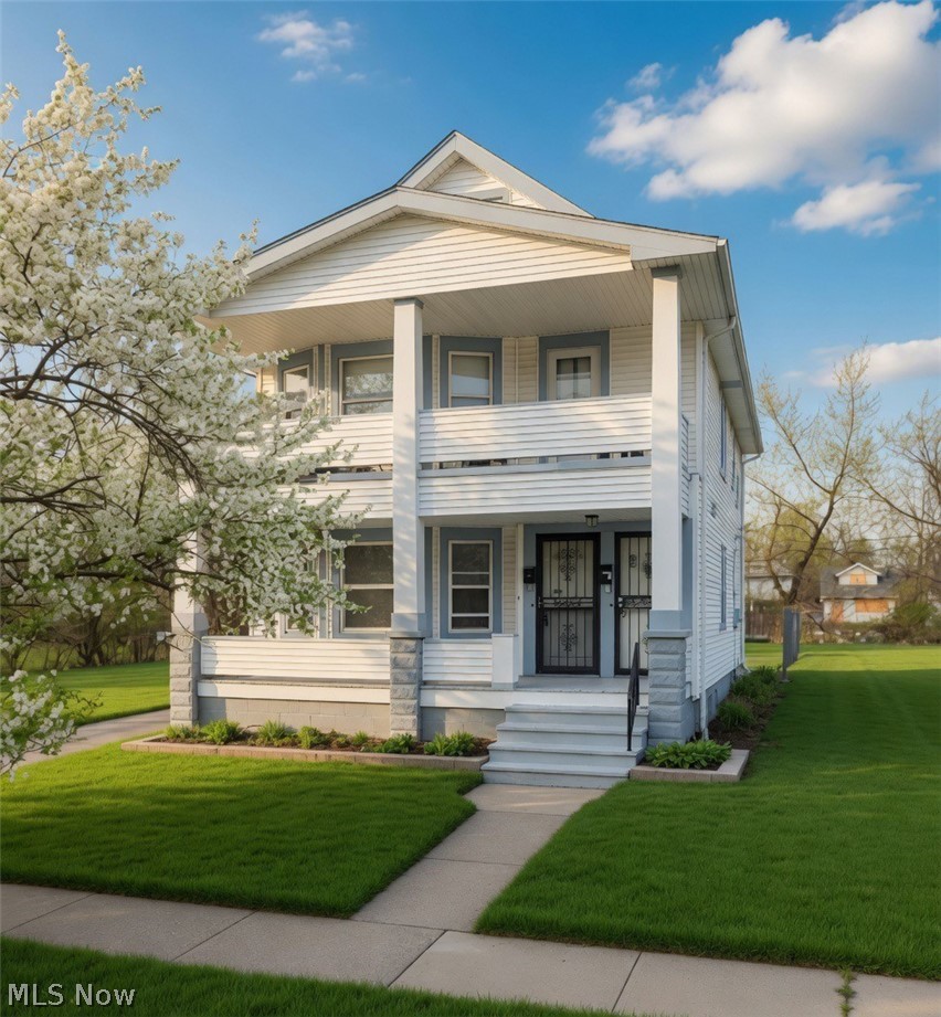 Front of the duplex featuring separate entrances.