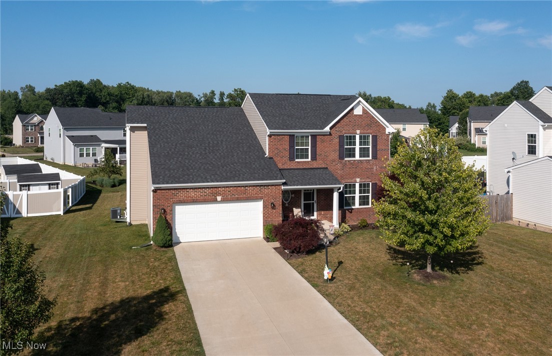 Tucked away on a quiet cul-de-sac in one of North Ridgeville’s most desirable developments, this spacious 5-bedroom home offers over 2,500 square feet of comfortable living and thoughtful design. Built in 2016 with timeless curb appeal, the full brick front welcomes you into a warm and neutral interior featuring rich black cherry cabinetry, granite countertops, with stainless appliances which all stay and a bright morning room that opens to a low-maintenance composite deck—perfect for morning coffee or weekend grilling. A flexible first-floor bedroom is currently being used as a home office, while the finished basement adds even more versatility with a 6th bedroom, a third full bath, and plenty of space for entertaining, play, or guests. Set on an estate-sized lot, there's room to spread out and enjoy the outdoors. The community itself is a gem—with only one way in and out, it’s peaceful, full of kids and pets, and features a neighborhood playground that adds to its charm and sense of connection. If you’re looking for space, function, and a truly welcoming location, this home checks every box!