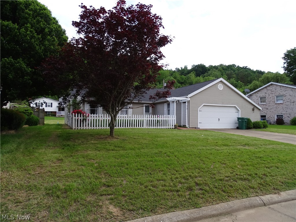 Wonderfully renovated 3 BR, 2 bath home with open concept living on nice level lot in a nice quiet residential neighborhood. This home has had many updates including both baths, fresh paint thru-out, new back sitting porch, some flooring and much more. Nice courtyard in the front with fenced in area. Property has Pearl St. access in the rear. Priced right - this home won't last long!