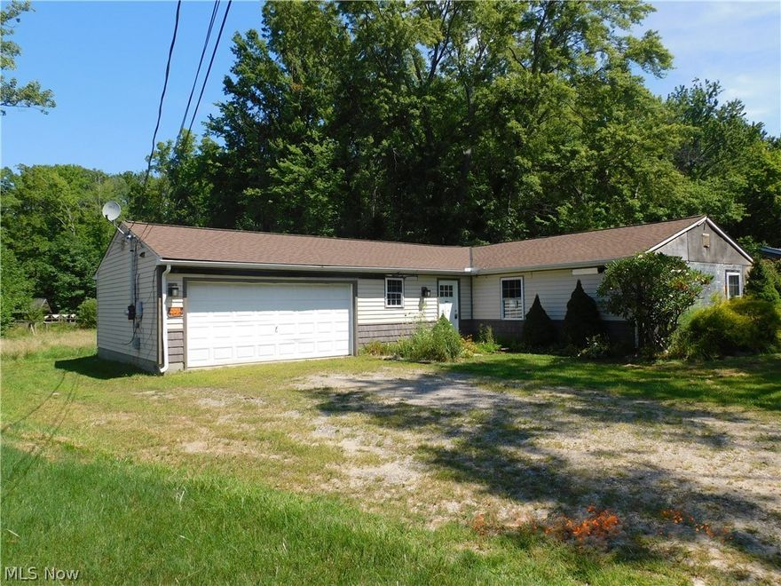 Madison Township 3 bedroom 2 full bath ranch on a slab foundation. This home features a spacious living room with fireplace and sliders to the back yard, a modern kitchen with ample cupboard and counter space. 3 good sized bedrooms with large closets. A family room, utility room and 2 car attached garage. The 265 ft  yard affords a large back yard. City water, sewer are used for this home.