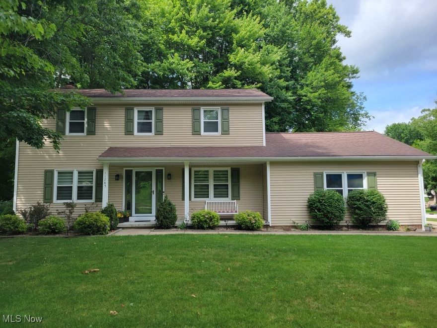 Welcome to this beautifully maintained 1988 Center Hall Colonial, (roof 2010) perfectly nestled on a picturesque, wooded corner lot that offers both privacy and charm, with new siding and windows in 2015.  This timeless 4-bedroom, 2.5-bath (updated 2017), home blends classic design with thoughtful updates, creating the ideal setting for modern living. Step inside to discover a well-balanced layout with generously sized rooms, ideal for everyday comfort & entertaining. The living room & dining room flank the central hallway, offering elegant spaces with abundant natural light with the custom blinds dressing up the windows. Both the kitchen and living room have a slider to access the Trex deck.  A spacious living room also boasts a gas log fireplace and provides the perfect retreat with views of the surrounding trees in the backyard. The updated (2017) kitchen features granite countertops, stainless steel appliances, ample cabinetry, and an island with a breakfast bar and two barstools overlooking the serene backyard and deck. Throughout the main level, engineered wood flooring adds warmth and sophistication. Upstairs, you’ll find four well-proportioned bedrooms, including a primary suite with an en-suite bath and ample closet space. Two full bathrooms upstairs have been tastefully appointed, providing comfort and functionality. Additional highlights include newer windows that enhance energy efficiency and natural light, a full finished basement with an office, bonus room, and recreation room ready for your finishing touches and updates.  The two and one-half car garage has room for storage with the shed in the backyard provides a place for all yard tools and deck items. Outside, enjoy the beauty of mature trees, and the peaceful setting only a wooded corner lot can offer.
Delightfully appointed and meticulously cared for, this home offers a rare blend of character, comfort, and convenience. Don’t miss the opportunity to make this special property your next home!