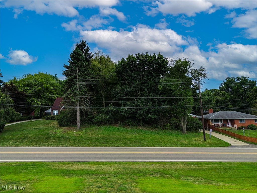 This is a prime location for this Plain Twp 1.12-acre site. Build the home of your dreams or whatever your plans may be. The lot is currently wooded, so you can decide how many trees to leave for privacy. Public water and sewer are available. This is currently zoned residential, but someone could apply for a variance with the township to see if zoning could be changed to commercial. That process takes about 2 months to complete. Please see attachments for the building requirements/setbacks from the Township. An approximate estimate of $4,000-$5,000 was given to clear .75 acres of trees. Buyer to verify any/all information with the local ordinances based on their intended use or questions. Bring your vision to this great piece of real estate!