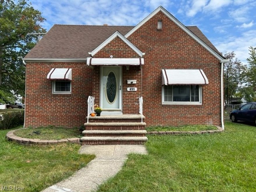 Beautiful and solid  3 bedroom Cape Cod with extensive square footage on a very spacious lot! Enter from the cute  enclosed porch into a charming kitchen with built in cabinets.   The first floor boasts a large dining room and living room along with an updated full bath and a  nice sized bedroom. The rooms flow nicely from one room to another and are filled with hardwood floors throughout. The upstairs has 2 sizable bedrooms with hardwood flooring as well. The lower level features a large partially finished basement with a separate laundry area, a half bath, and plenty of storage!  This home is in a great location in Euclid with easy highway access and its close to Lake Erie.