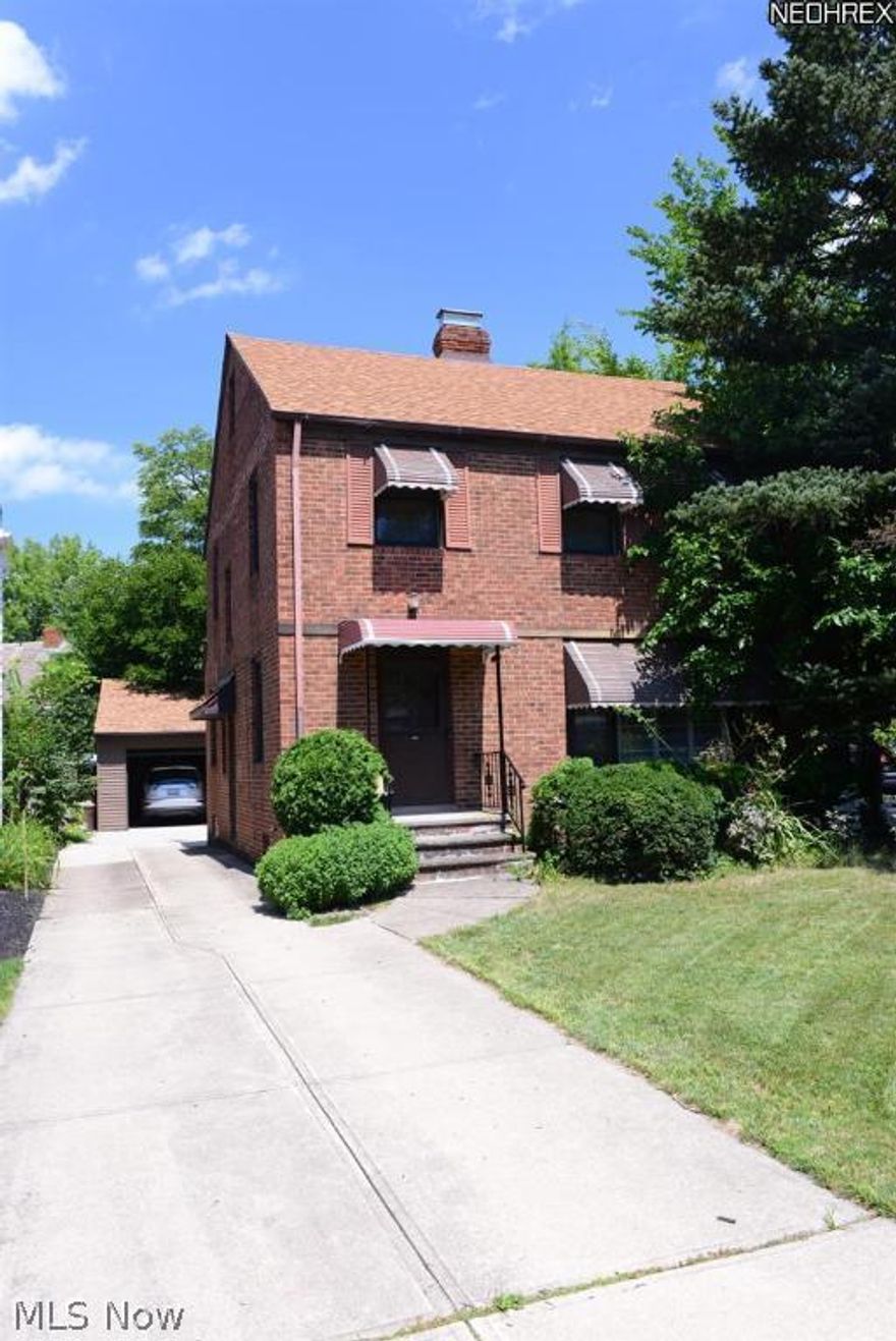 Lovely brick colonial in the heart of University Hts. Walking distance to new Cedar Plaza and yet still on a quite wooded street. Move-in Ready and   Violation Free. Updates in the last few years include: new roof (less than 3 years), windows (5 years), new garage (1 year), AC (2008), driveway, Granite countertops in the kitchen, newer paint and more. Laminate flooring in the  kitchen and office and hard wood in the rest of the house including all bedrooms. Ample closet space in all bedrooms. Finished rec room in the  basement with water hookup is a bonus. House was also professionally waterproofed from the outside. The owners meticulously maintained their home and it shows. All appliances stay. Home Warranty included. Easy to show.
