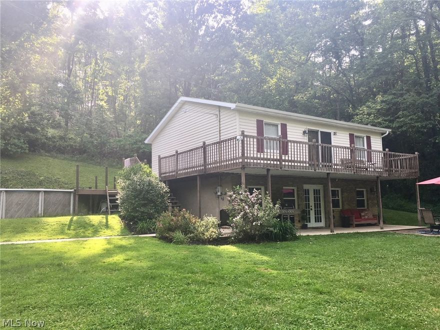 What a rare find! This is only the second time this home has ever been on the market. Located on a dead end with nearly 10 acres, you will find this mechanic and hunters’ dream home. Want that country feel and seclusion without sacrificing city utilities? You got it! This home has city water and sewer, natural gas, and cable high speed internet capabilities. This 3 bed 2 bath home features a recently remodeled kitchen, dining room, and living room, including a natural gas fireplace. A laundry room and full bathroom on the first floor is an amenity all can appreciate. A beautiful spiral staircase leads upstairs to a spacious master bedroom, two additional bedrooms, an office, and another full bath. Outside, a ¾ wrap-around deck opens to the 21 ft round above ground pool you’ll be sure to enjoy on hot summer days. The furnace and central air units were replaced in 2015 and the water heater was replaced in May 2020. New gutters, spouting, and gutter guard installed on the home and garage in 2016 make cleaning the gutters a thing of the past. New flooring throughout and lighting upgrades in 2018 make this home truly move-in ready.
The 2400 sq ft concrete block garage features 13-foot ceilings, a car lift, industrial air compressor, and a finished “man cave.” Upgrades include all new lighting, two ceiling fans, new ceiling insulation, and a new natural gas heater. You must see to appreciate everything this property has to offer! This one won’t last long! Agent owned
