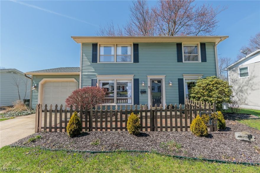 Welcome home to this charming Ivy Park colonial. Upon entering the front door you will find yourself in the bright and airy living room featuring hardwood floors and large picture windows. On the other side of the stairwell is the formal dining room also offering hardwood floors and currently being used as a playroom. The kitchen is placed conveniently off of the formal dining room and is also open to a flex space with a fireplace that could be used as an eating area, den, or both. A powder room for guests is also found on this level. Continue out to the three seasons room with walls of windows overlooking the lush and green landscape. A patio is found outside of the three seasons room and there is plenty of grass area beyond that. Upstairs the tranquil and spacious master bedroom boasts multiple closets and a sitting area. There are two additional guest rooms and a full bathroom drenched in light from a skylight also on this floor. The lower level provides a rec room with a bar as wel