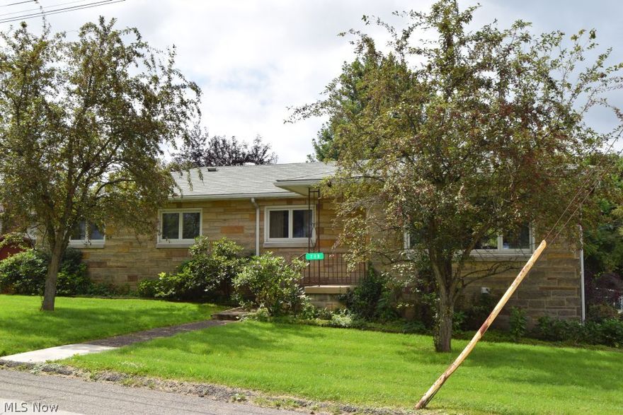 Lovely ranch home with beautiful stone exterior. Great relatively level fenced yard with shed in a terrific neighborhood. The home features 4 bedrooms (one being in the basement), 3 full baths, large living room/dining combo, nice custom kitchen cabinets, hardwood floors in 3 of the bedrooms, and some newer windows per owner. 2 car tandem garage in basement.