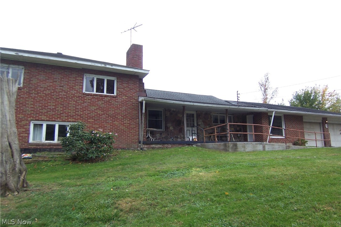 3-4 bed 4 level split in need of work on 10.2 gorgeous acres w/48x96 barn! Outdoor woodburning furnace heats house and hot water. Oil hot water baseboard boiler works but needs attention, keeps cycling, also electric hot water tank for summer months. Barn has concrete floor in 2/3 and dirt in remaining back. Workshop area and 2 loft areas, water. Property goes straight back down hill to two open pastures and into woods. Creek snakes thru back of property. House is dated, was 3 bedrooms upper level however wall between 2 has been removed. Main level has hardwood floors under carpet in bed, dining room and kitchen. Laundry area on this level. Brick breezeway connects to the 3+ car garage. Family room has masonry fireplace with air tight woodburner insert. Safe stays with house however no combination, locksmith will need to be consulted. As is estate. Great potential! No FHA or VA. Listing agent related to seller.