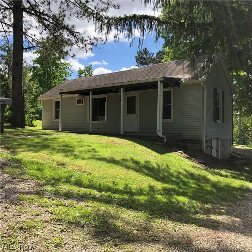 Quiet and mostly private home featuring eat-in-kitchen with pantry, front patio and walk-around sidewalk. Nice open yard for many outdoor activities. All windows has been updated. Convenient outbuilding offers concrete flooring and electric. Over-sized parking area.