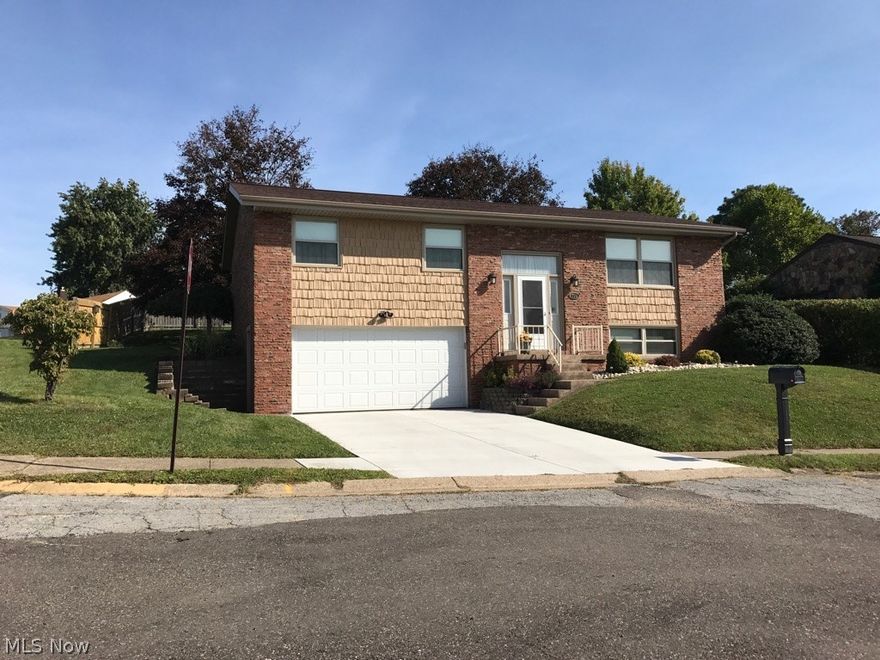 Split entry 3 bedroom home with rec room, full bath and large storage closet in basement. Custom kitchen cabinets.  Hardwood floors. Rear has wood deck  & privacy fencing. All brick exterior.This home has been completely been gutted & remodeled (Everything like new). Just move in!