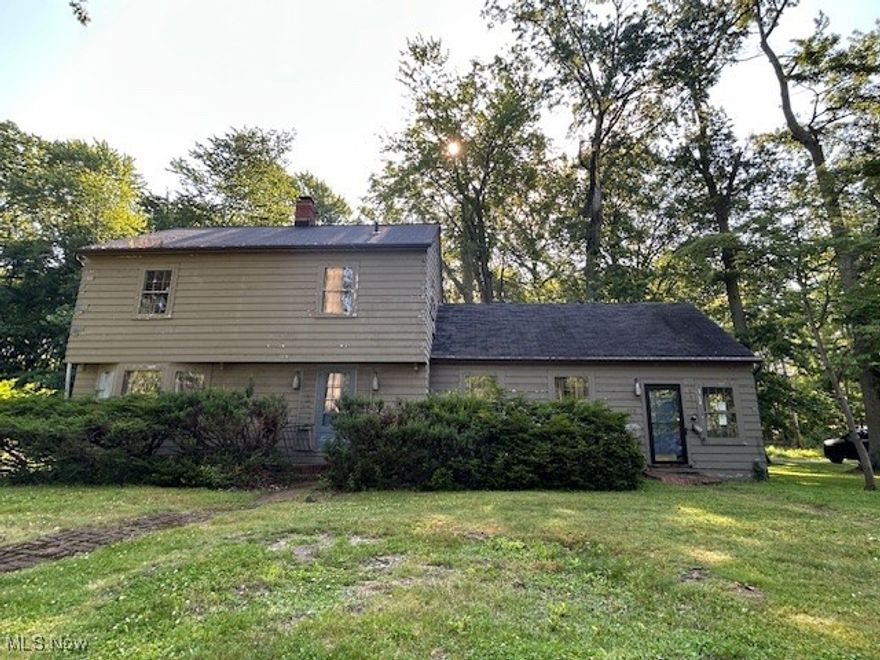 Don’t miss this truly one-of-a-kind opportunity in Avon Lake!
Nestled in a prime location, this spacious home sits on a rare TRIPLE lot (100' x 145' front 2 lots plus a 3rd 96' x 181' lot) that backs directly to Bicentennial Park and is just steps from the 18-acre campus of Troy Intermediate School. Brimming with character and loaded with potential, this property is a blank canvas ready for your custom vision.  Situated on three parcels, this property offers an expansive backyard and side yard, providing ample outdoor space. The home offers exceptional flexibility with three rear entrances, two front entrances, a large rear deck that spans the entire length of the home, a detached two-car garage, and both front and rear driveways. A private entrance leads to an added office space and full bath on the main level—perfect for a home business, guest suite, or in-law setup.

Inside, you'll find a spacious living room with a fireplace and a formal dining room—both featuring built-in cabinets and patio doors to the expansive deck. The kitchen includes adjacent first-floor laundry hookups, and two smaller rear rooms offer the potential to create a generous mudroom, utility space, or even an expanded kitchen area.

The main entry is accented with unique stone flooring and a nearby half bath for guests. Upstairs, you’ll find three bedrooms, one with an en-suite full bath, a second full bath, a finished bonus room connected to one of the bedrooms, and an adjacent unfinished storage room—perfect for future expansion or extra storage.  

While the home needs a full renovation inside and out, the possibilities are endless. With its large footprint, versatile layout, and unbeatable location, this is a rare opportunity to create your dream home in one of Avon Lake’s most desirable areas. Close to Avon Lake’s highly rated schools, a fantastic community library, restaurants, coffee shops, unique local businesses, and amazing outdoor recreation activities!