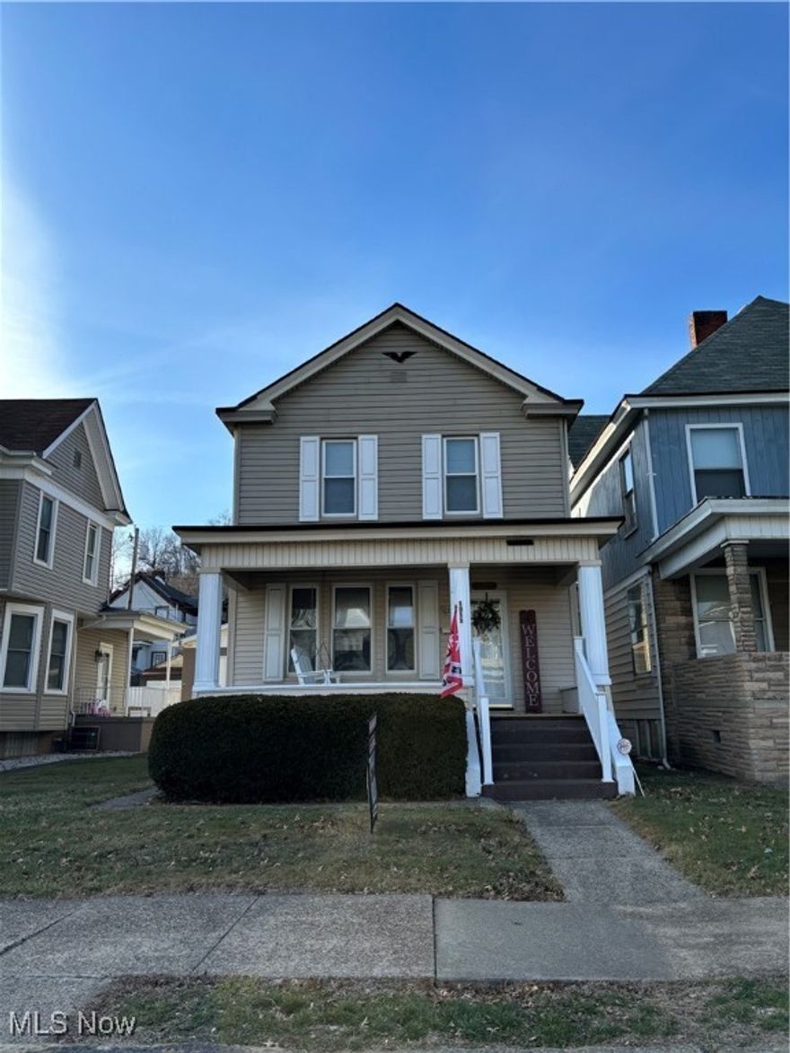 Seller offering $3000 towards Buyers Closing Costs for new appliances with acceptable offer. Here it is!! Newly updated two-story, 2 bedroom, 2 bath home with a detached one car garage!!  You are going to love the care the owners put into improving this home! Nice level lot, in town close to everything with a walkway from the front to the back for easy access to and from the garage.  You will love relaxing on the covered front porch with swing! Walk into a nice open floor plan living room with a decorative fireplace, dining room all neutral painted with new floors and beautiful original woodwork trim.  Nice size kitchen with lots of cabinets and space for your appliances. Basement is large with a full bath and walk up to outside.  Two bedrooms offer new lighting, blinds, flooring, paint and lots of closet space.  Detached garage has concrete floor, cabinets, electric and opener.  Home Warranty