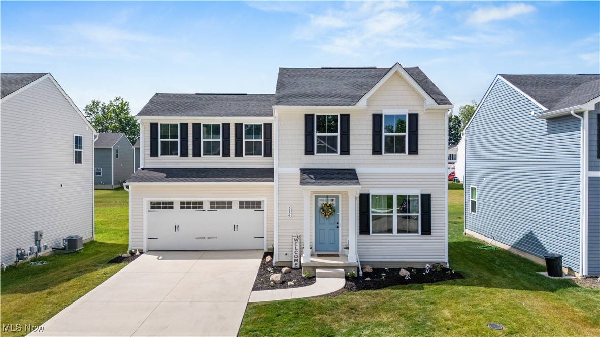 Welcome to this brand-new colonial home! Boasting Midview Local Schools and an excellent location, this is definitely the house for you! Enjoy the perks of living in a newly built home without having to wait for all things that come with building. Upon arrival you are met by an inviting home with pretty landscape. Prepare to fall in love as you enter the home. The upgraded LVP flooring covers the main floor from the living room to the kitchen. A beautiful, faux fireplace was added to the living room with the most beautiful green tiles. The neutral kitchen is open to the living room and offers plenty of counter space, a pantry and a gorgeous backsplash that was designer approved! Upstairs you will find the spacious primary suite offering a walk-in closet and private bath. 2 more bedrooms, a full bathroom and SECOND FLOOR laundry compete this level. The full basement offers a rough-in for a future bathroom and plenty of space to finish to your specifications. Be sure to check this home out and you're sure to fall in love!!