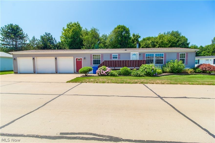 This beautiful manufactured home offers 3 bedrooms with the master bedroom including a full master bath including a jacuzzi tub! This home has a lot of space to entertain with the dining room, kitchen, and living all flowing into one. This move in ready home also has great exterior appurtenances including a front porch made from trex decking with concrete filing underneath the porch, and a HUGE 3 car garage with heat, water, and it's own electrical box with 220 line ready for a generator. Seller is willing to contribute $2000 towards new carpeting and/or blinds of the buyers choosing. You are not going to want to miss this mobile park home living at it's best!