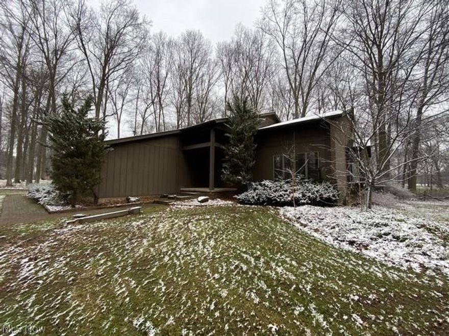 Beautiful rustic looking home set on a wooded lot is open and airy with sun room, half bath, 1st floor laundry, large eat in kitchen with island that leads to family room with fireplace,  great room with vaulted ceiling and stairway leading upstairs with 3 bedrooms, master bath and another full bath.  Property also features a full basement, 2 car attached garage.  This property must be seen to be appreciated!!!