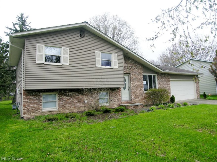 Three Bedroom 1 1/2 bath split  with 2 car attached garage situated on  a large lot! Family room has wood burning fireplace.  Pictures show baseboard heaters in rooms but hot forced air  Furnace and central air are installed. Property was built prior to 1978 and lead based paint potentially exists.